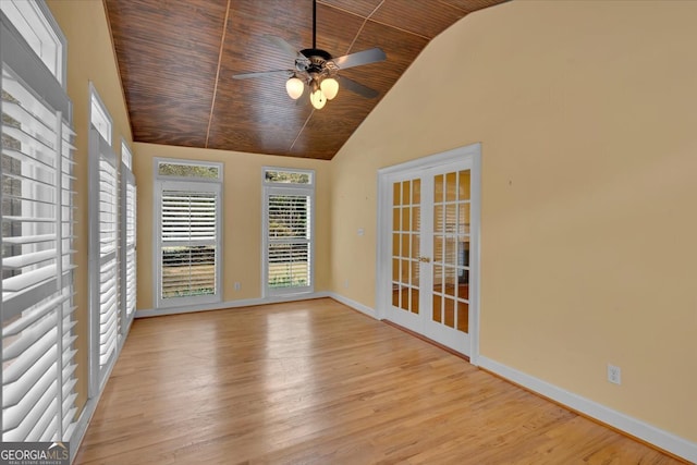 interior space featuring wood ceiling, french doors, lofted ceiling, and ceiling fan