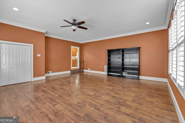 unfurnished room featuring crown molding, hardwood / wood-style flooring, and ceiling fan