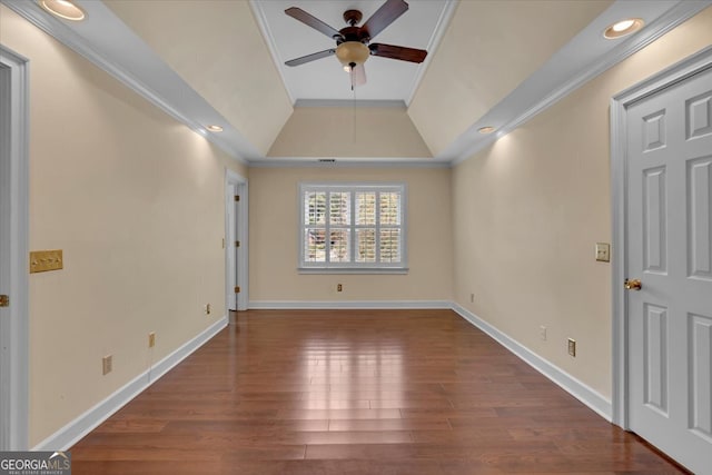 spare room with ornamental molding, ceiling fan, vaulted ceiling, and dark hardwood / wood-style flooring