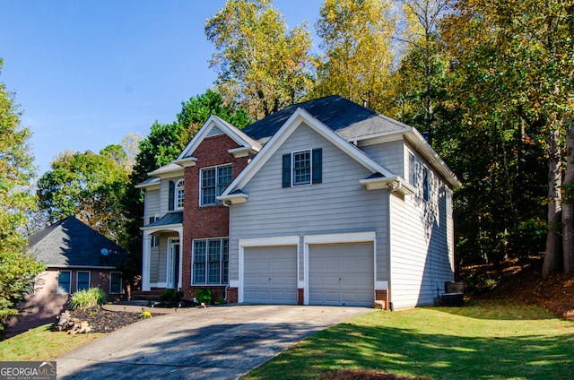 view of front of home featuring a front lawn and a garage