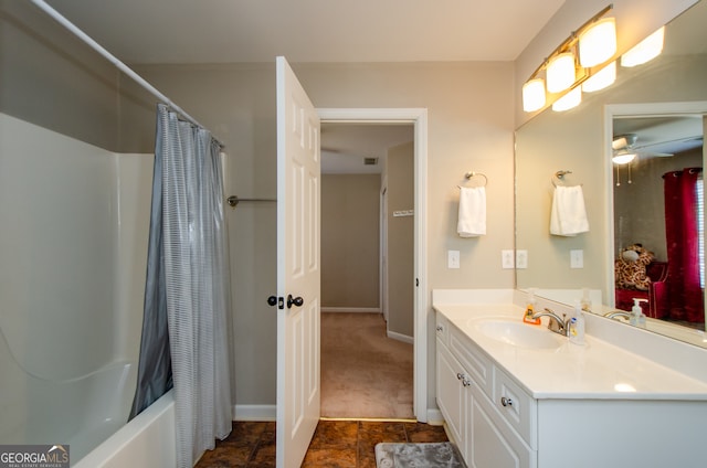 bathroom with vanity, shower / tub combo with curtain, and ceiling fan