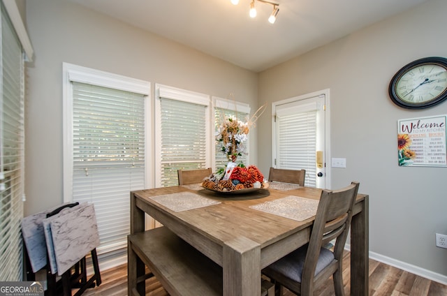 dining area with wood-type flooring