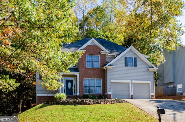 view of front property with a front yard and a garage