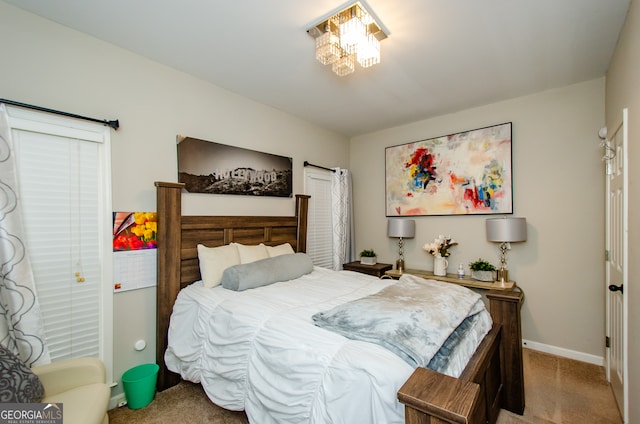 bedroom featuring light carpet