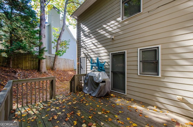 wooden terrace featuring area for grilling