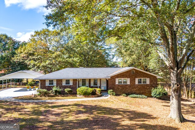 single story home with a carport