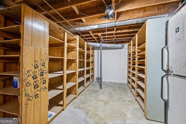 basement featuring white fridge