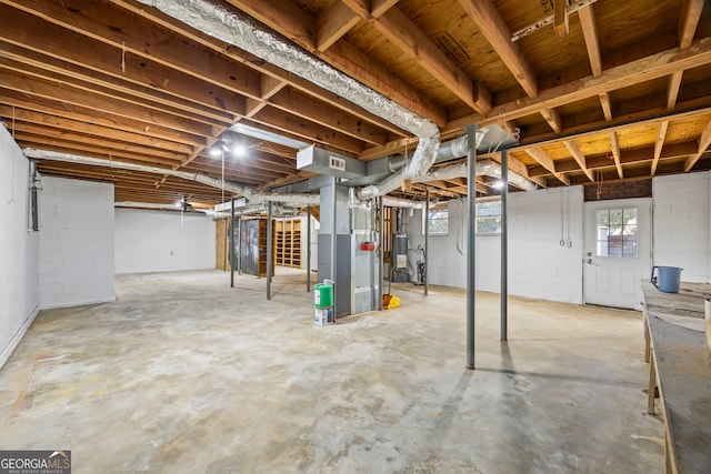 basement with gas water heater and heating unit