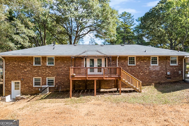 back of house with a wooden deck