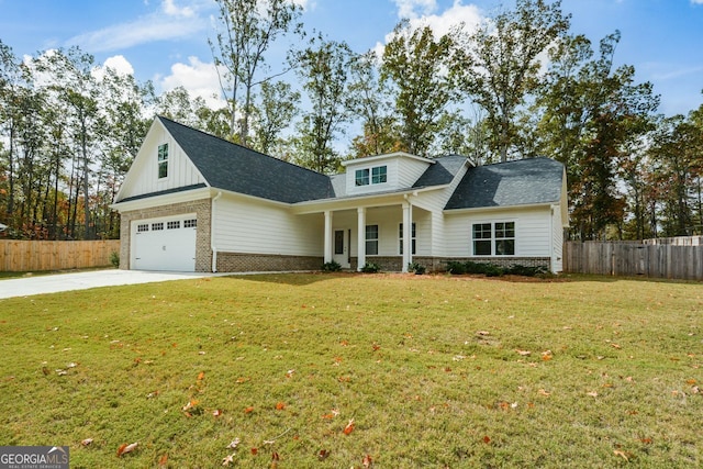 view of front of house with a porch, a front yard, and a garage