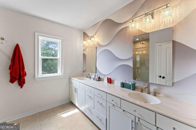 bathroom featuring vanity, a shower with shower door, and tile patterned flooring