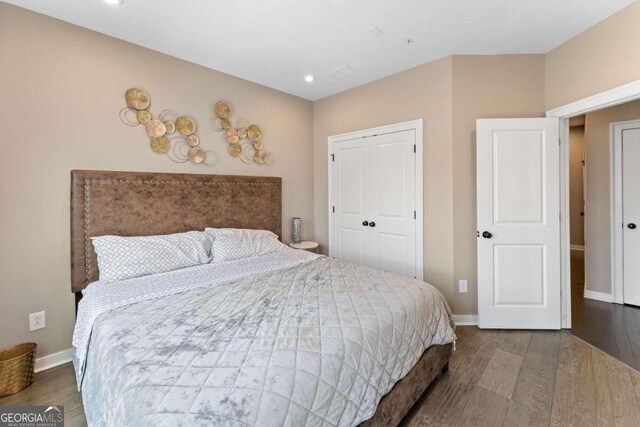 bedroom with a closet and wood-type flooring