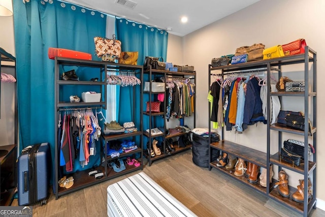 walk in closet featuring hardwood / wood-style floors