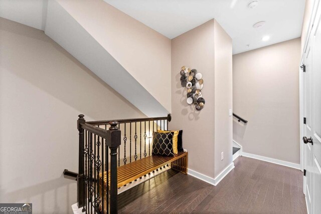 stairway featuring wood-type flooring