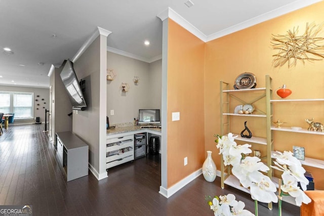 interior space featuring ornamental molding and dark hardwood / wood-style flooring