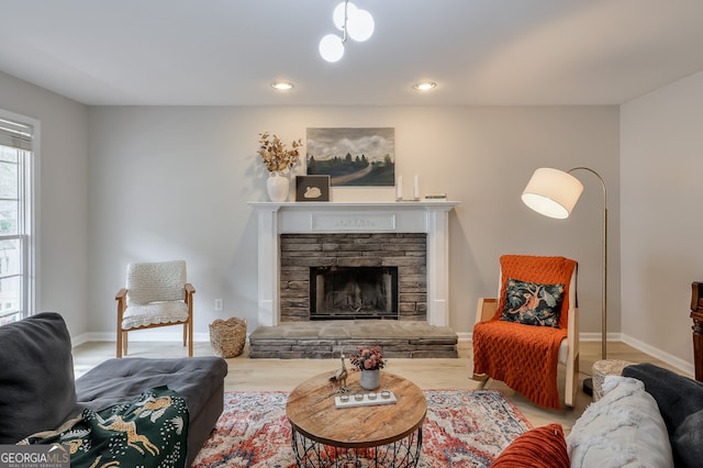 living room featuring hardwood / wood-style flooring and a fireplace