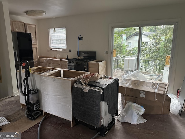 kitchen with light brown cabinets and black gas range