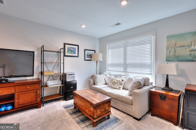 living room featuring light carpet