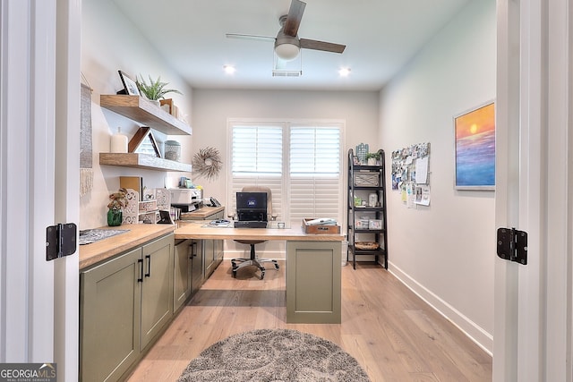 office area with light wood-type flooring and ceiling fan