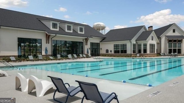 view of swimming pool featuring a patio