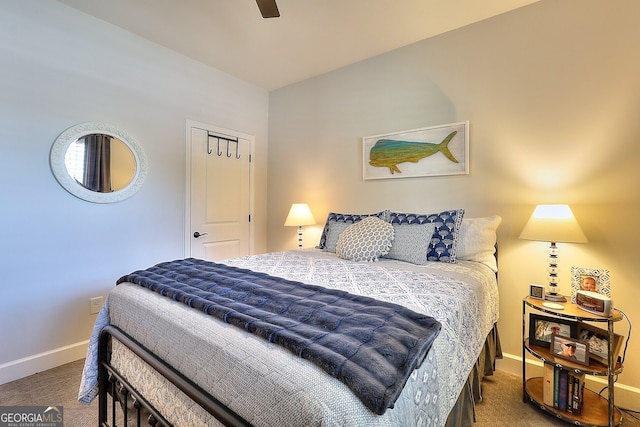 bedroom featuring dark colored carpet and ceiling fan