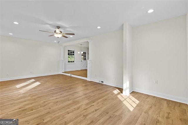 spare room featuring light hardwood / wood-style floors and ceiling fan