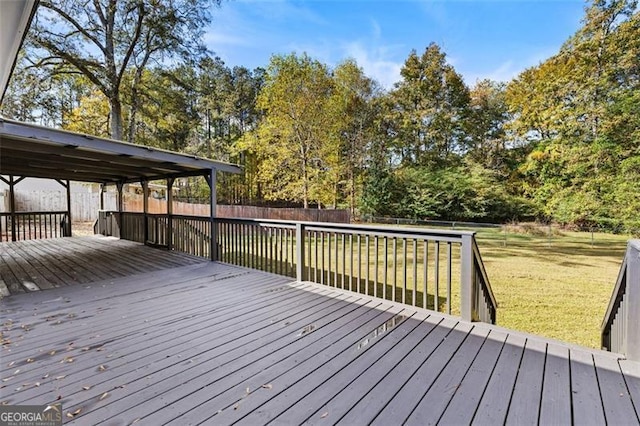 wooden deck featuring a yard