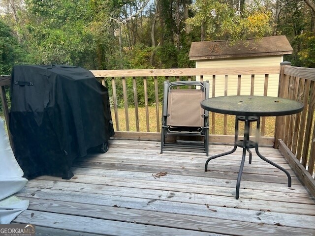 wooden terrace with grilling area