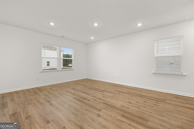 empty room with light hardwood / wood-style floors