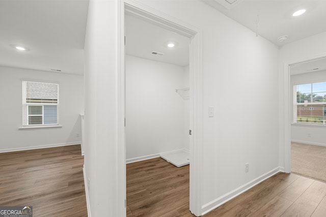 corridor with dark wood-type flooring