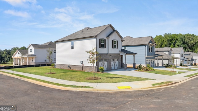 view of front of house featuring a front yard and a garage