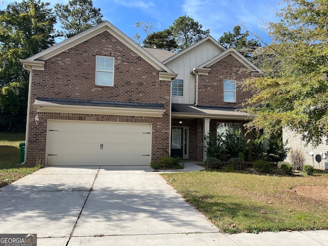 view of property with a garage and a front yard