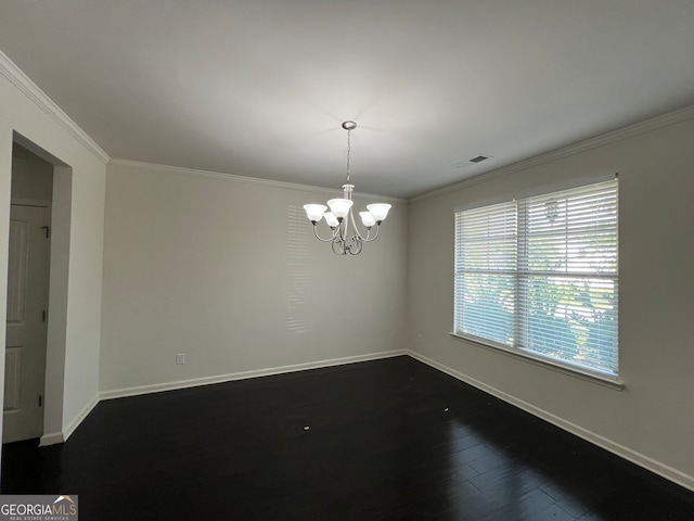 spare room with wood-type flooring, a notable chandelier, and ornamental molding