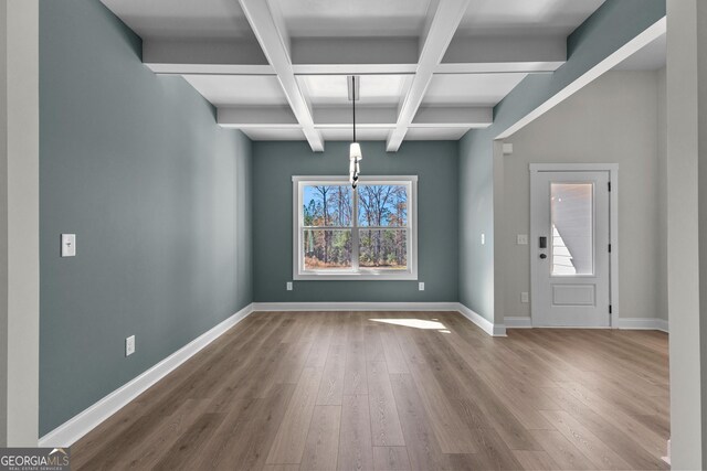 kitchen featuring sink, hanging light fixtures, stainless steel appliances, gray cabinets, and light hardwood / wood-style flooring