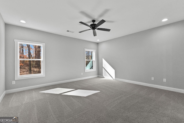 carpeted empty room featuring ceiling fan