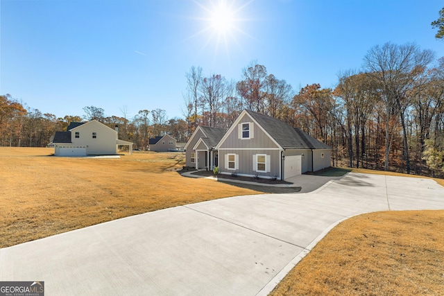 view of front facade with a front yard and a garage