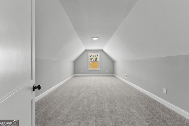 bonus room featuring carpet and lofted ceiling