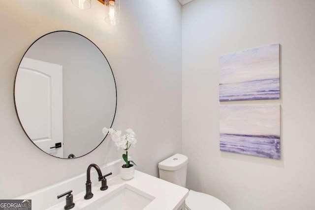 bathroom with vanity and toilet