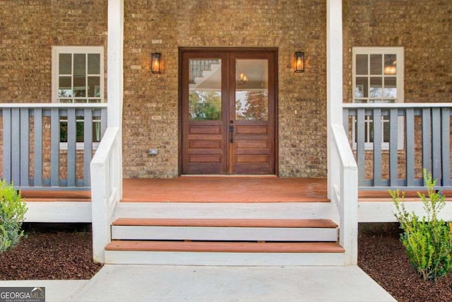 doorway to property with covered porch