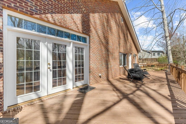 wooden terrace featuring french doors