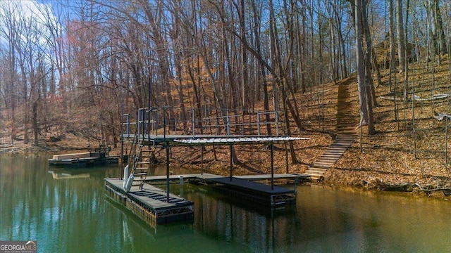 dock area with a water view and stairs