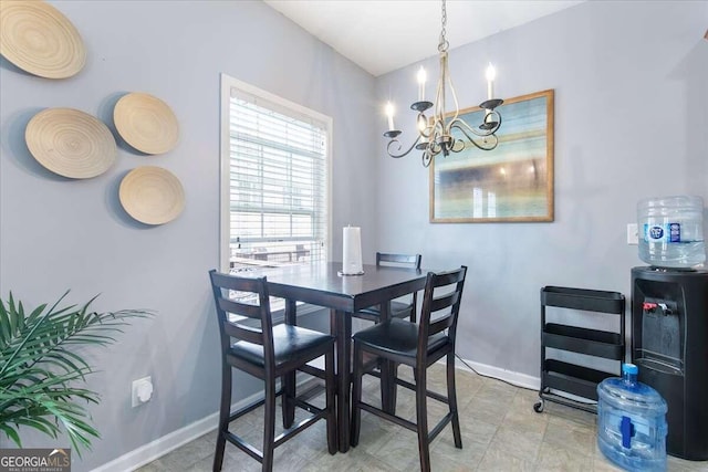 dining area featuring an inviting chandelier