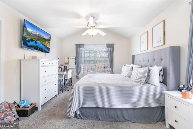 bedroom featuring light colored carpet, lofted ceiling, and ceiling fan