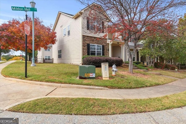 view of home's exterior featuring a lawn