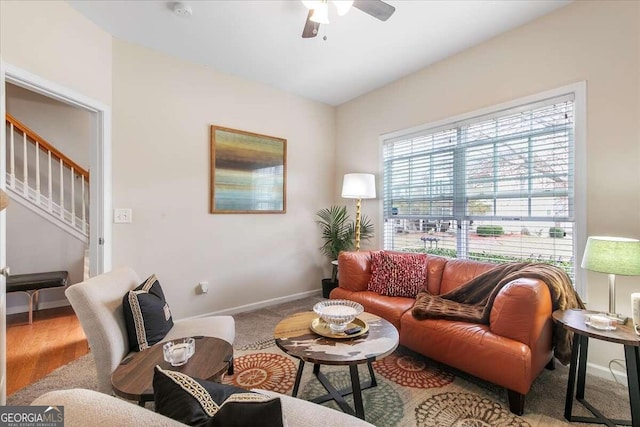 living room featuring ceiling fan and wood-type flooring