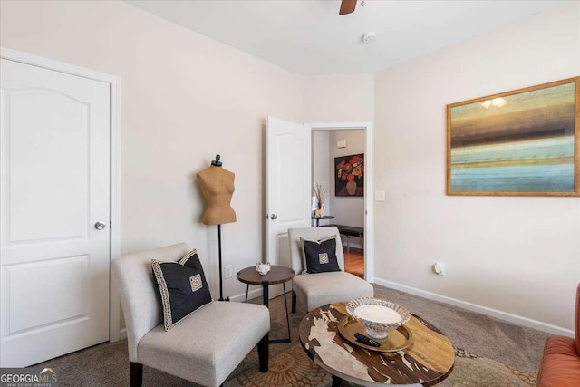 sitting room featuring carpet flooring and ceiling fan