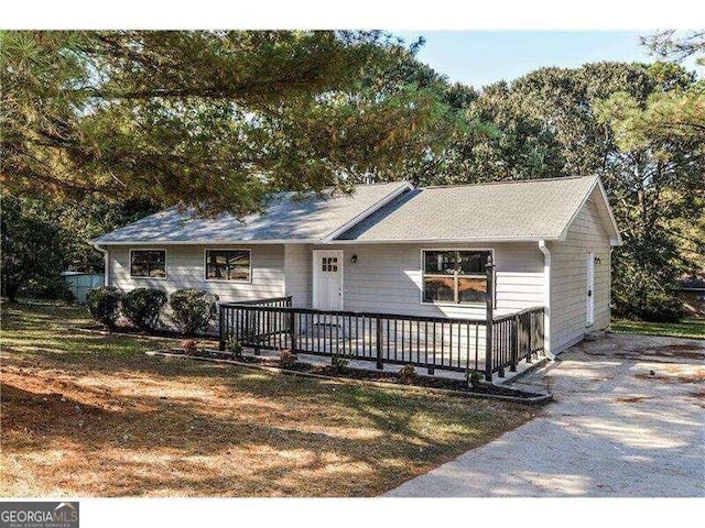 ranch-style home featuring a deck