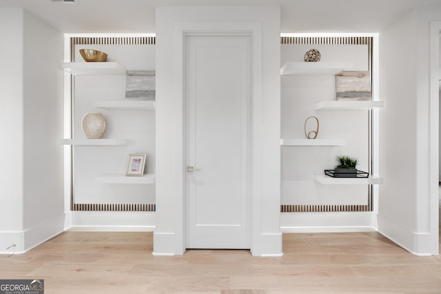 interior details featuring hardwood / wood-style floors