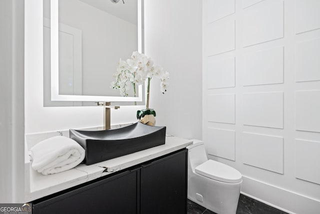 bathroom with vanity and toilet