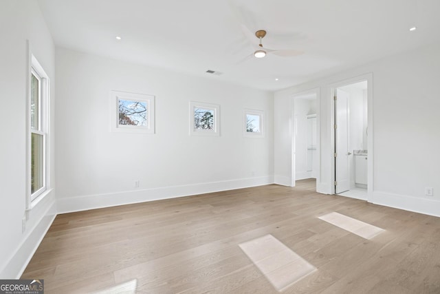 empty room featuring ceiling fan and light hardwood / wood-style flooring